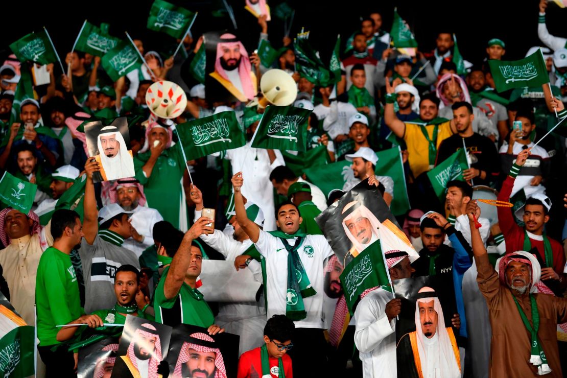 Saudi supporters cheer during the 2019 AFC Asian Cup group E football match between Saudi Arabia and Qatar.