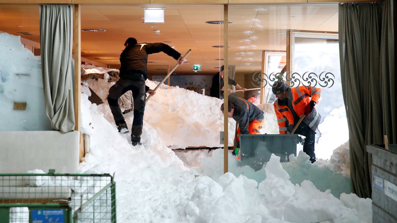 Workers shovel snow out of a restaurant on Friday, January 11, after <a href="https://www.cnn.com/2019/01/14/weather/winter-weather-europe-intl/index.html" target="_blank">an avalanche engulfed</a> the Santis-Schwaegalp mountain resort in Switzerland.