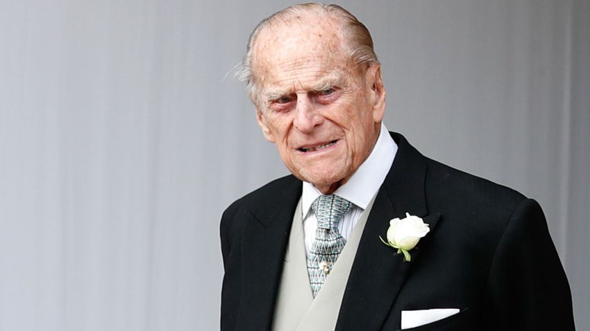 Britain's Prince Philip, Duke of Edinburgh waits for the carriage carrying Princess Eugenie of York and her husband Jack Brooksbank to pass at the start of the procession after their wedding ceremony at St George's Chapel, Windsor Castle, in Windsor, on October 12, 2018. (Photo by Alastair Grant / POOL / AFP)        (Photo credit should read ALASTAIR GRANT/AFP/Getty Images)