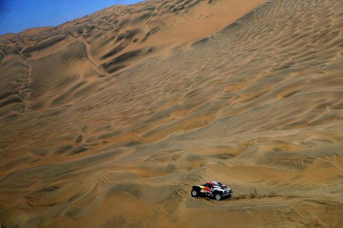 The car driven of Cyril Despres dissects the sparse landscape during stage seven of the Dakar.