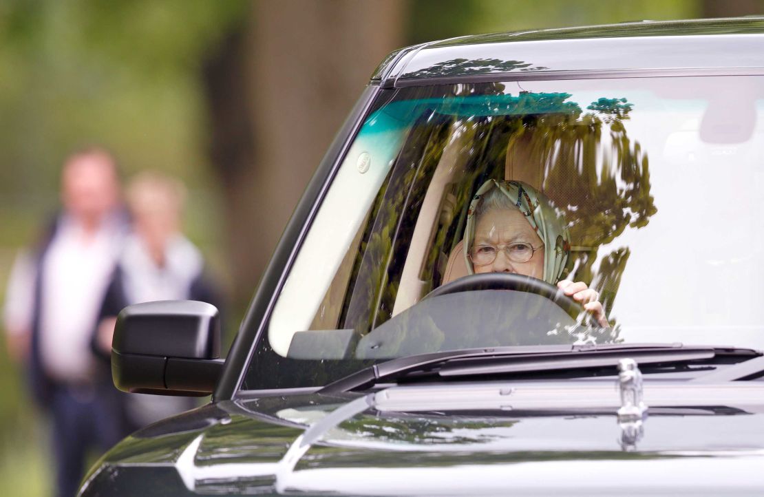 Queen Elizabeth II drives her Range Rover at the Royal Windsor Horse Show in May 2017.