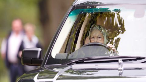 Queen Elizabeth II drives her Range Rover at the Royal Windsor Horse Show in May 2017.