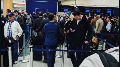 Some travelers waited in security lines for more than two hours at Atlanta's Hartsfield-Jackson International Airport on Monday. The government shutdown has led to increased absences among TSA workers nationwide, putting a strain on airport checkpoints.
