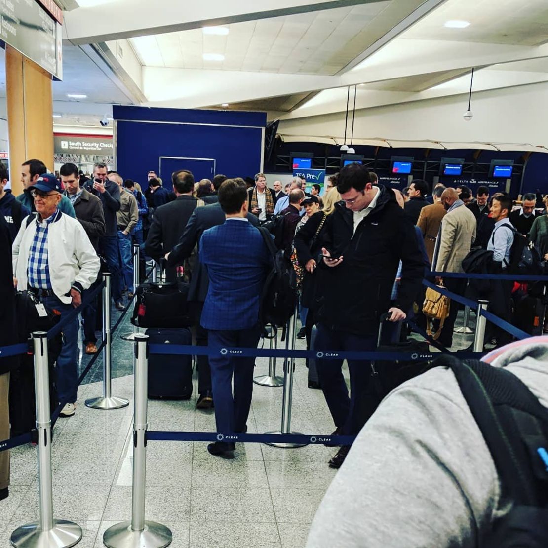 Some travelers waited in security lines for more than two hours at Atlanta's Hartsfield-Jackson International Airport on Monday. The government shutdown has led to increased absences among TSA workers nationwide, putting a strain on airport checkpoints.