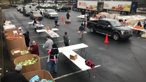 Federal workers line up for groceries from the Atlanta Community Food Bank and a local church.