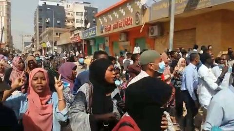 People take part in protests calling for the President's resignation in Khartoum, in an image grab taken from AFP TV on Thursday.
