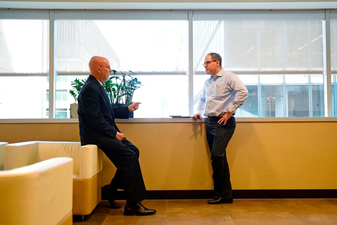 Wall, left, talks with fellow partner Louis Beardell at the Morgan Lewis offices in Philadelphia.