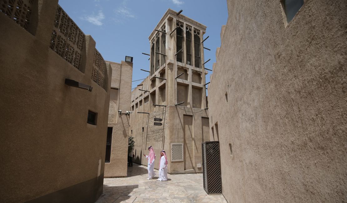 A traditional wind tower, or "barjeel," in Dubai. The structure is open-sided at the top, with an interior dividing panel encouraging a cooler breeze to divert down into the building while air pressure forces warmer air up and out of the other side.