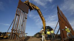 Construction crews install new border wall sections on January 9, seen from Tijuana, Mexico.