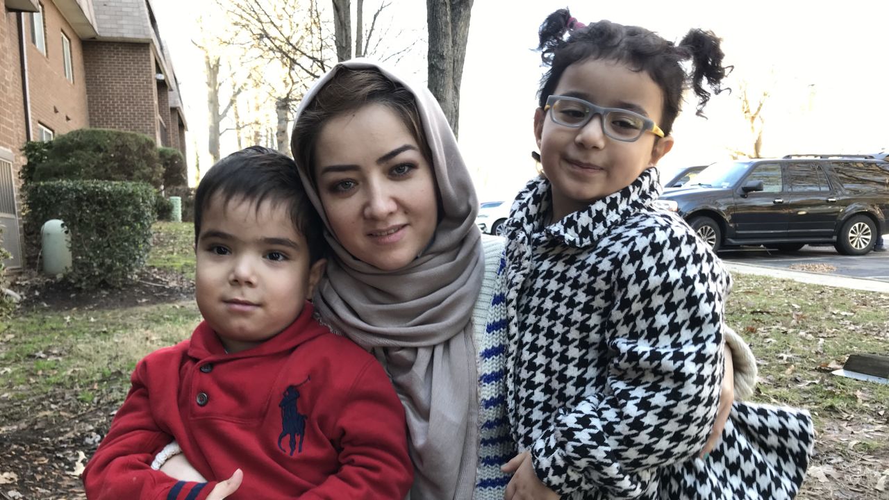Tursun with her two surviving children, Moez (left) and Elina (right).