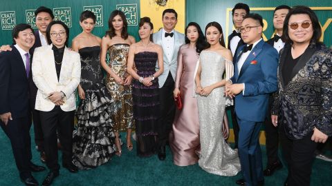 Kwan, right, poses for a picture with the cast and crew of "Crazy Rich Asians" at the film's August premiere at Los Angeles' Chinese Theatre.