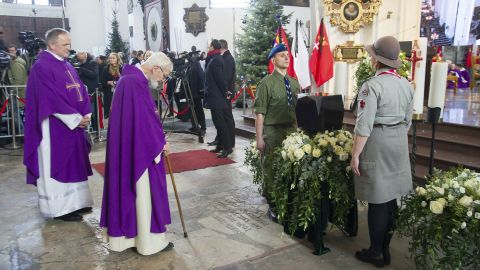 Catholic priests bow before the urn with ashes of slain Gdansk city Mayor Pawel Adamowicz at the start of his funeral in Gdansk on Saturday.