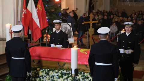 Ceremonial guards stand by the coffin of Pawel Adamowicz during a Catholic mass at St. Mary's Basilica following a procession through Gdansk on Friday.