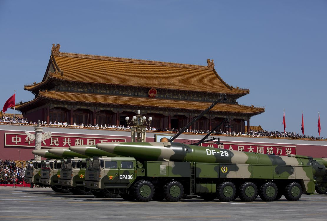 Chinese military vehicles carrying DF-26 ballistic missiles drive are seen during a 2015 military parade in Beijing.