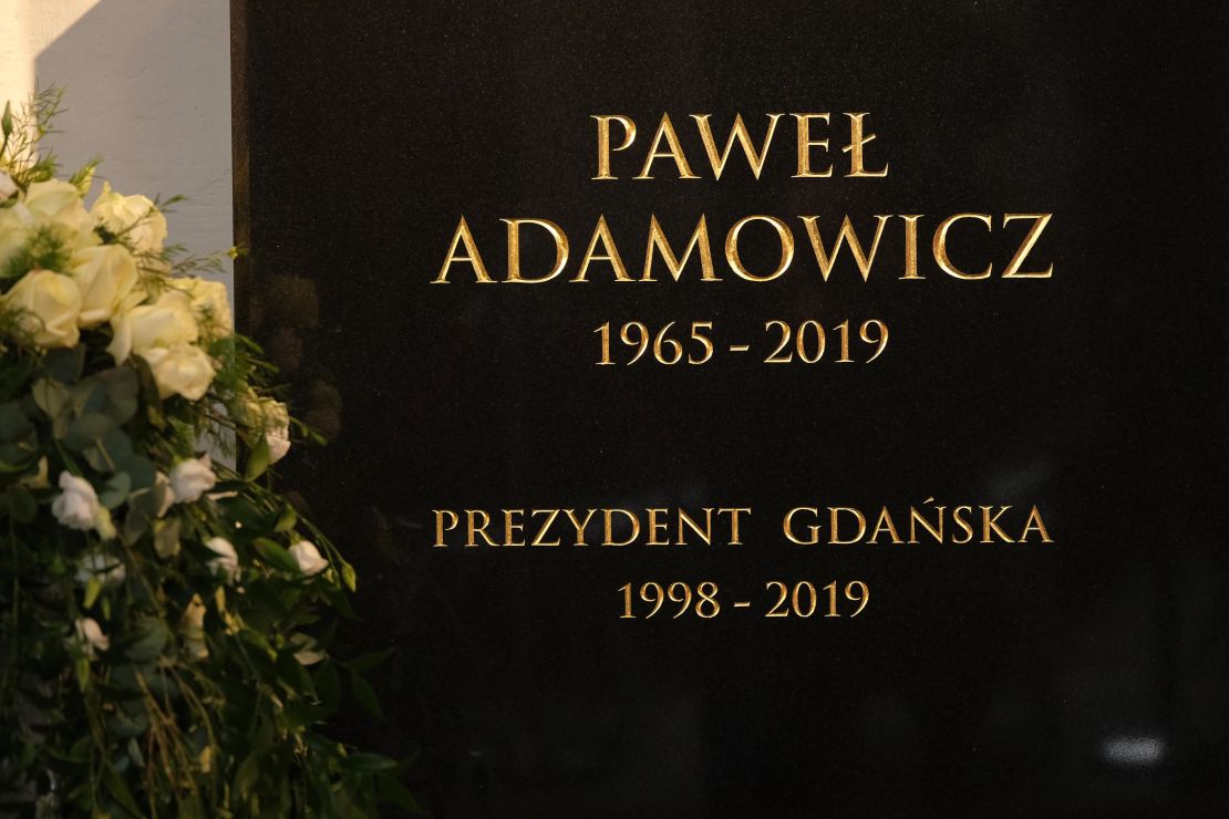 The tombstone of Gdansk Mayor Pawel Adamowicz hangs on a wall prior to his funeral in St. Mary's Basilica, Gdansk, on Saturday.