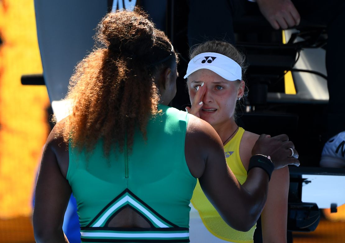 Serena Williams consoles Dayana Yastremska after their Australian Open match Saturday. 