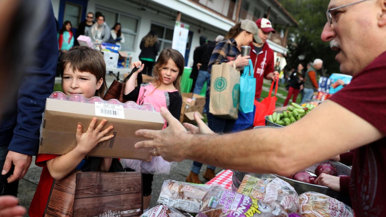 US Coast Guard families receive free groceries during a food giveaway in Novato, California, on Saturday, January 19. Thousands of active-duty Coast Guard members weren't getting paid during the shutdown. The Coast Guard is the only military branch under the Department of Homeland Security.