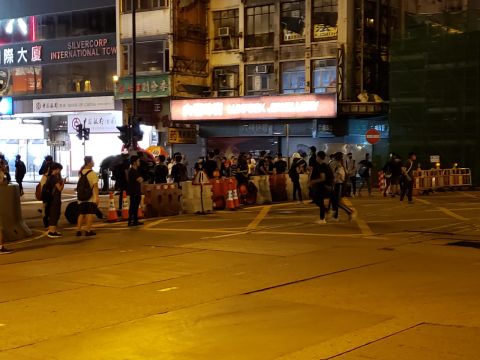 Protesters set up barricades off Nathan road.