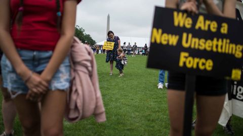 Protesters at a rally in Washington are pictured with the Washington Monument in the background on June 23, 2018.