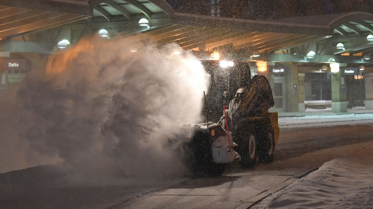 Crews clear snow at the Albany International Airport in Colonie, N.Y., Sunday, Jan. 20, 2019.