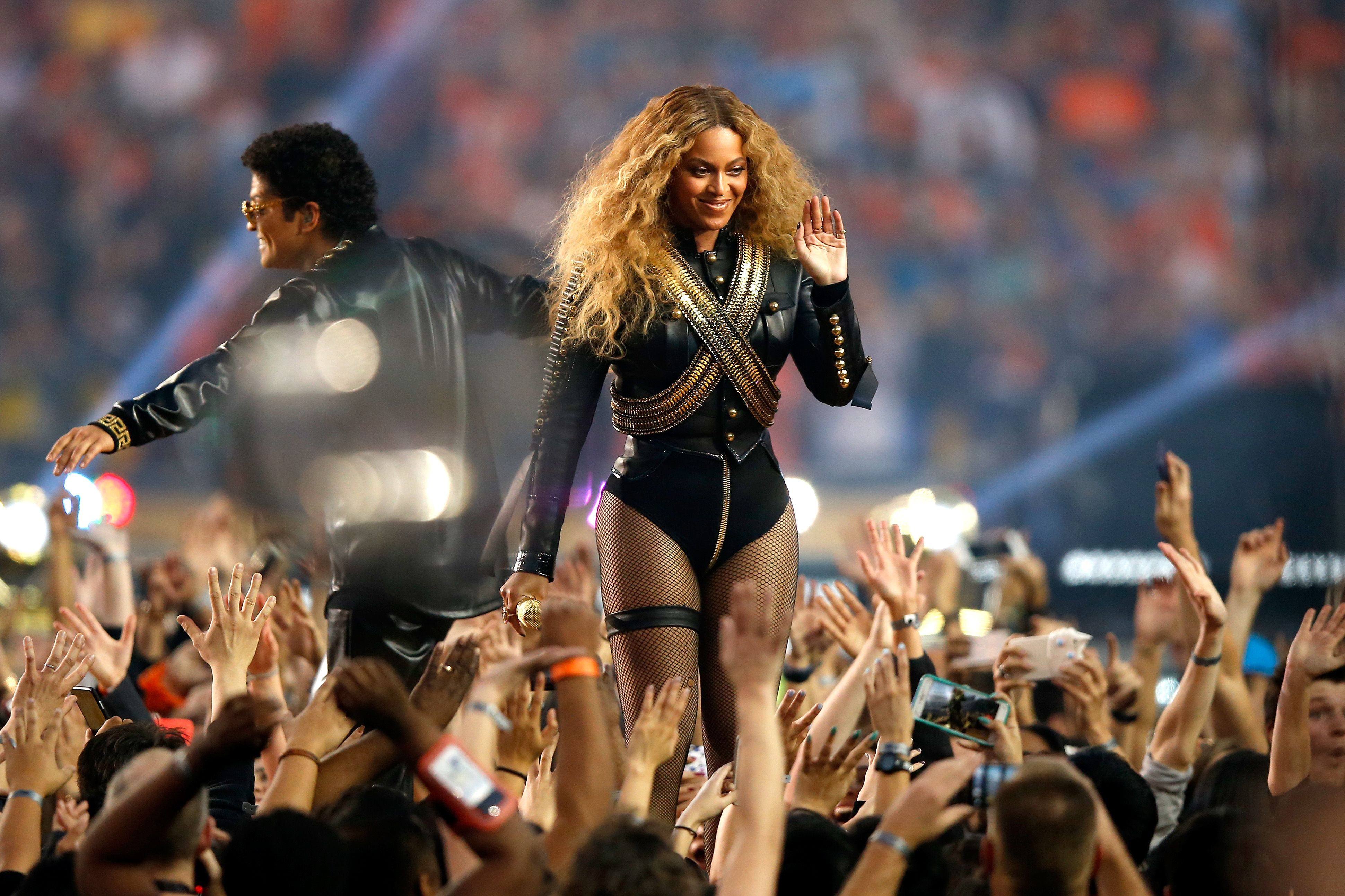 15 best-ever NFL Super Bowl half-time concert outfits: from Rihanna's  Loewe-dressed baby bump and Beyoncé's 'Michael Jackson jacket' to Madonna's  Givenchy crown and Shakira and J.Lo's Versace looks