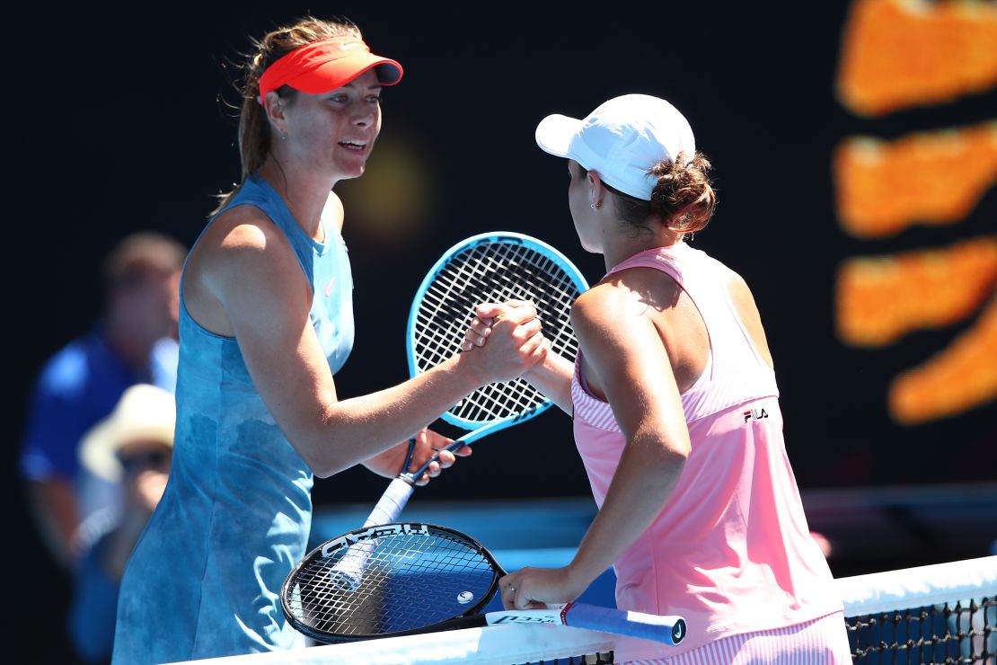 Maria Sharapova shakes hands with Ash Barty at the Australian Open. 