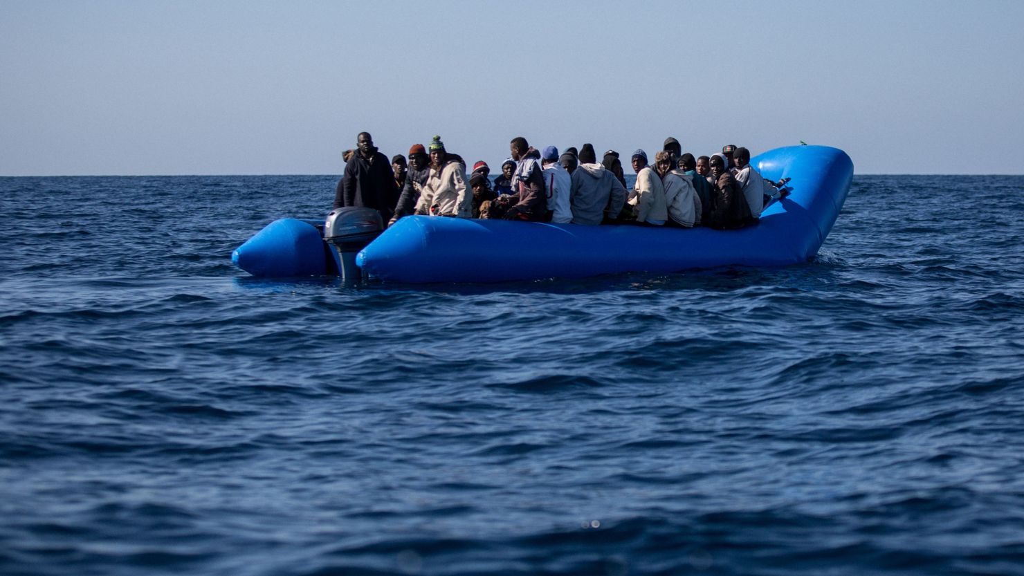 An unflatable boat with 47 migrants on board is pictured while being rescued by the Dutch-flagged Sea Watch 3 off Libya's coasts on January 19, 2019.