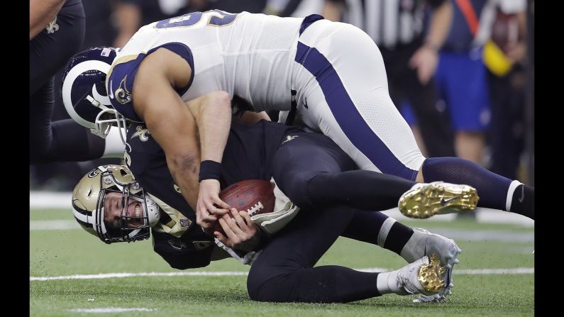 New Orleans Saints quarterback Drew Brees is sacked by Los Angeles Rams' Ndamukong Suh during the first half of the NFC Championship game on Sunday, January 20, in New Orleans. <a href="index.php?page=&url=https%3A%2F%2Fbleacherreport.com%2Farticles%2F2816722-jared-goff-rams-rally-to-stun-drew-brees-saints-in-ot-advance-to-super-bowl" target="_blank" target="_blank">The Rams won 26-23</a> in overtime to advance to the Super Bowl.