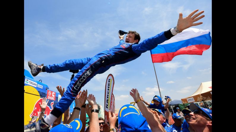 Russian co-driver Evgenii Iakovle is congratulated by team members after winning the Dakar Rally in Peru, on Thursday, January 17.