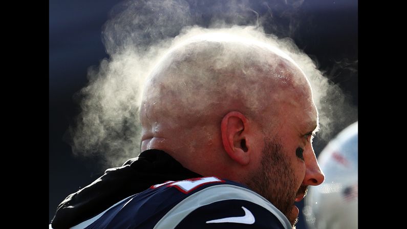 Steam rises from the head of New England Patriots backup quarterback Bryan Hoyer during an NFL Divisional Playoff game at Gillette Stadium in Foxborough, Massachusetts, on Sunday, January 13.