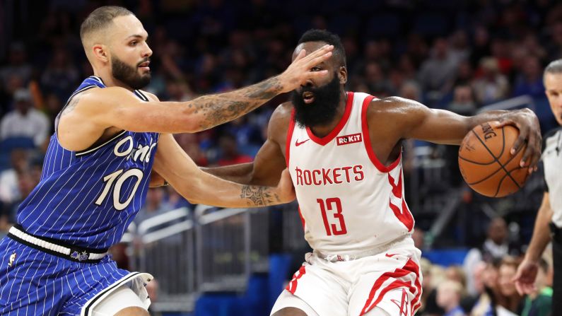 Houston Rockets guard James Harden drives to the basket against Orlando Magic guard Evan Fournier during the second quarter of an NBA game at Amway Center in Florida on Sunday, January 13.