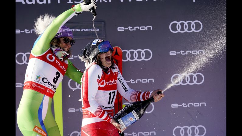 Austria's Ramona Siebenhofer, right, celebrates her World Cup downhill victory with second-place finisher Ilka Stuhecin in Cortina D'Ampezzo, Italy, on Friday, January 18.