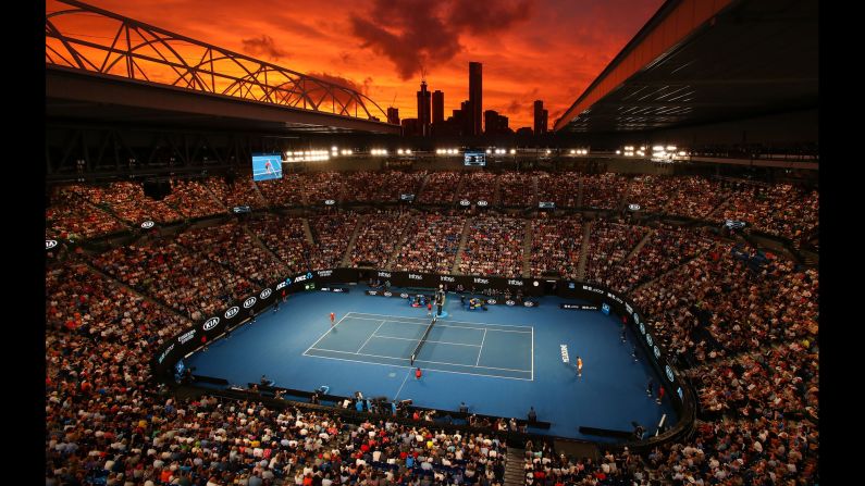 The sun sets over Rod Laver Arena during a tennis match between Alex De Minaur and Rafael Nadal on Friday, January 18 in Melbourne, Australia.