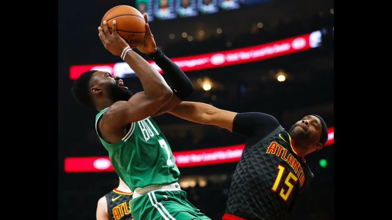 Boston Celtics guard Jaylen Brown shoots over Atlanta Hawks forward Vince Carter during the first half of an NBA  game on Saturday, January 19.