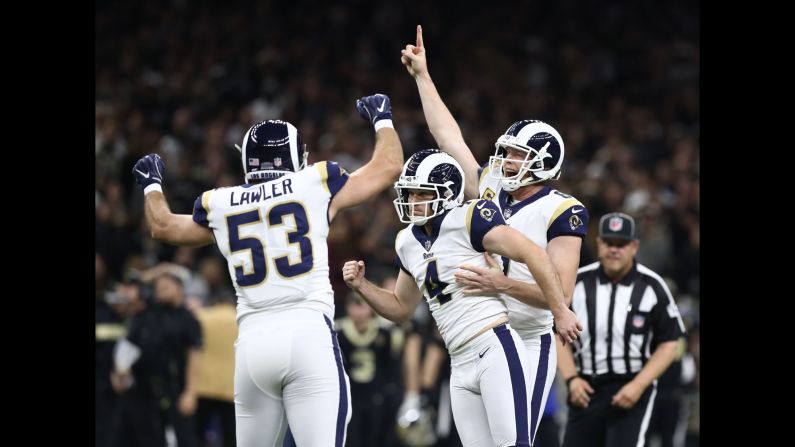 Los Angeles Rams kicker Greg Zuerlein, center, celebrates with punter Johnny Hekker, right,  and defensive end Justin Lawler after kicking a 57-yard game-winning field goal against the New Orleans Saints on Sunday, January 20. The Rams will face the New England Patriots in Super Bowl LIII on February 3. <a href="index.php?page=&url=https%3A%2F%2Fwww.cnn.com%2F2019%2F01%2F13%2Fsport%2Fgallery%2Fwhat-a-shot-sports-0113%2Findex.html" target="_blank">See 35 amazing sports photos from last week.</a>