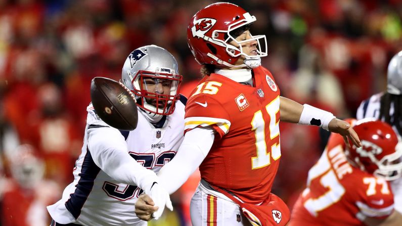 Patrick Mahomes of the Kansas City Chiefs fumbles the ball as he is hit by New England Patriots' Kyle Van Noy during the second quarter of the AFC Championship game at Arrowhead Stadium on Sunday, January 20. 