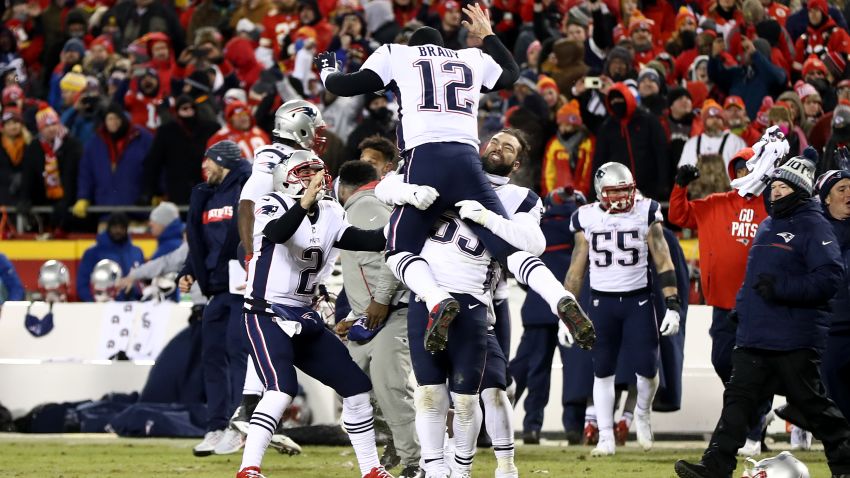 Tom Brady of the New England Patriots celebrates with teammates after defeating the Kansas City Chiefs in overtime.