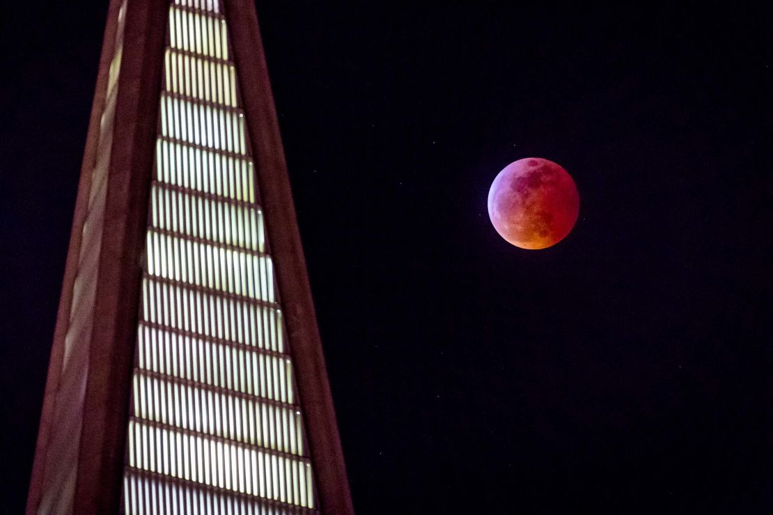 The super blood wolf moon rises behind the TransAmerica building in San Francisco.