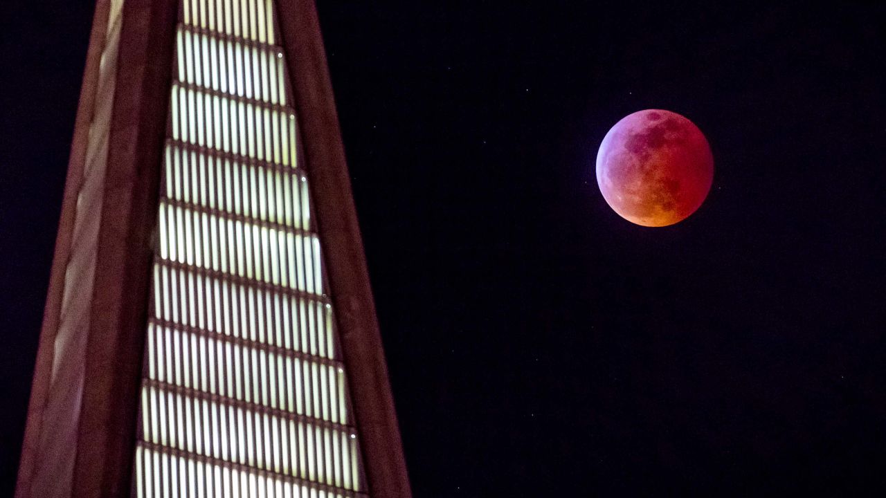 The super blood wolf moon rises behind the TransAmerica building in San Francisco.