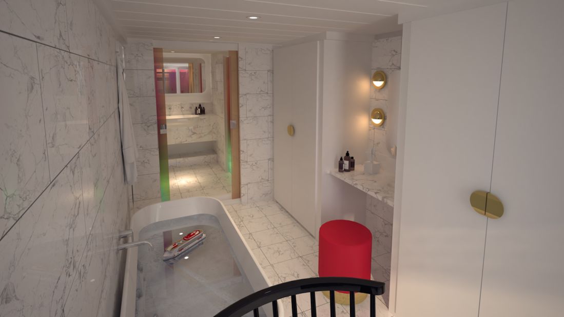 <strong>The Bathrooms: </strong>Suites feature top to bottom marble bathrooms with dichroic glass windows and shower doors. 