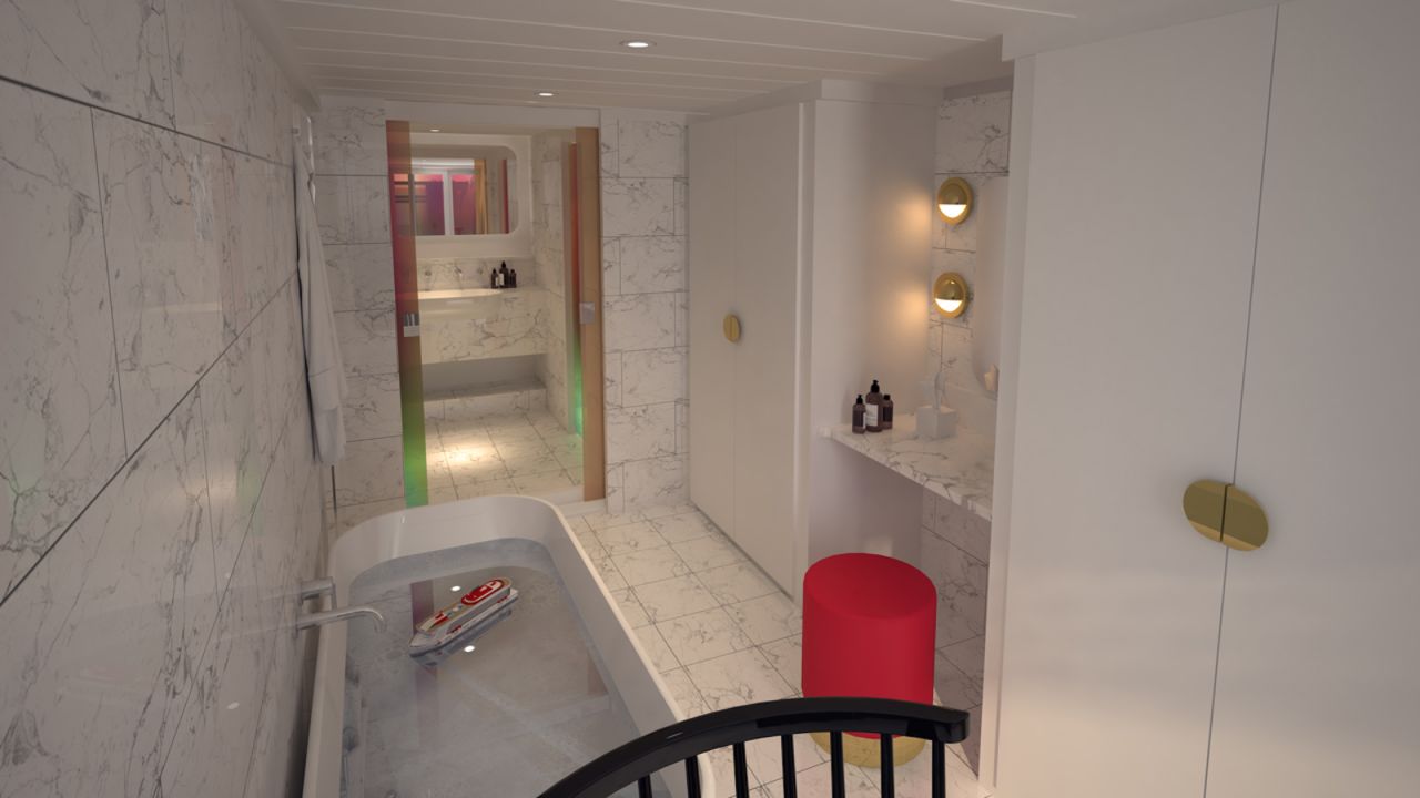<strong>The Bathrooms: </strong>Suites feature top to bottom marble bathrooms with dichroic glass windows and shower doors. 