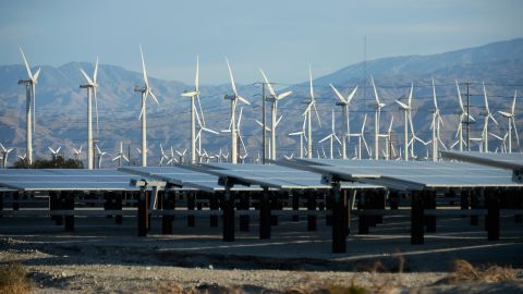 Power companies are increasingly switching to natural gas and renewable energy, such as these wind turbines and solar panels in Palm Springs, California.  (Photo by Kevork Djansezian/Getty Images)