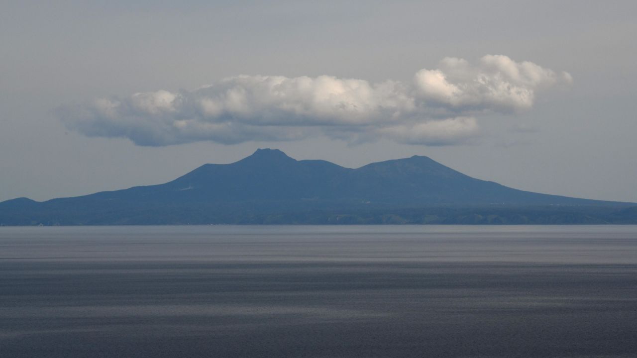 Kunashiri island, part of an archipelago under Russian control, seen from the Rausu Kunashiri Observatory Deck in Rausu, Hokkaido prefecture. 
