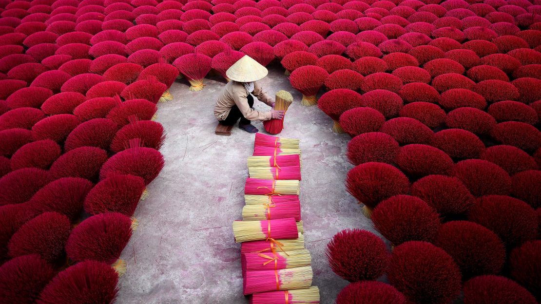 Quang Phu Cau is considered Vietnam's 'incense village." Hundreds of workers have been hard at work dying, drying and whittling down bamboo bark to make the fragrant sticks ahead of the busy Lunar New Year holiday.