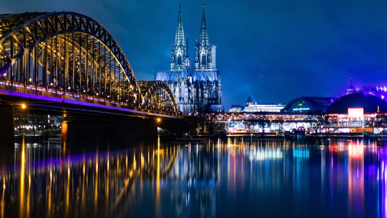<strong>Cologne, Germany: </strong>Cologne Cathedral, Hohenzollern Bridge and the Musical Dome (pictured right) are reflected in the Rhine river. <br />