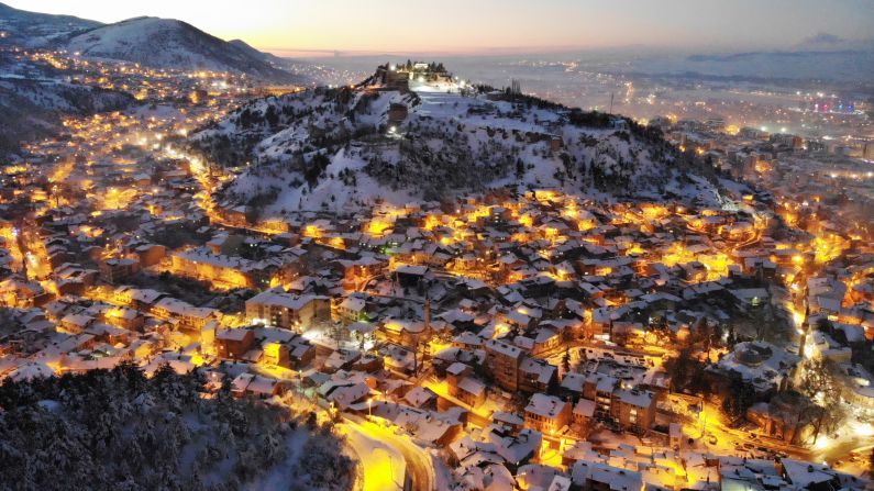 <strong>Kütahya, Turkey:</strong> The Byzantine castle of Kütahya stands out above the snow-covered rooftops and winter street lights of the Turkish city. <br />