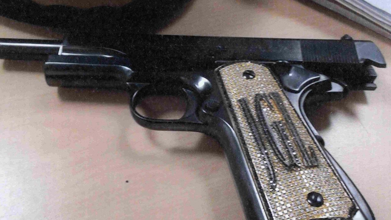 A photo of a diamond-encrusted pistol was among the evidence presented in the case. 