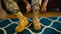 WAHIAWA, HAWAII - MARCH 26:  Army Sergeant Shane Ortega laces up boots before posing for a portrait at home at Wheeler Army Airfield on March 26, 2015 in Wahiawa, Hawaii.  (Photo by Kent Nishimura/For The Washington Post via Getty Images)