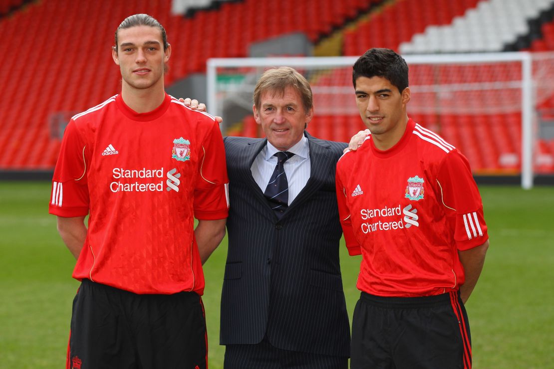 Andy Carroll (left) joined Liverpool at the same time as Luis Suarez (right).
