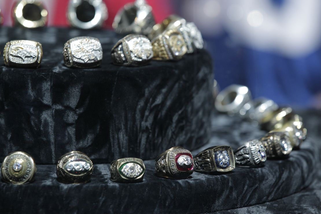 Past Super Bowl rings on display.